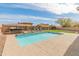 A refreshing private pool surrounded by a patio and complemented with a spa and seating area at 30259 N 125Th Ln, Peoria, AZ 85383