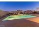 Backyard pool featuring a hot tub, fire pit, lounge chairs, and lush landscaping for outdoor enjoyment at 30259 N 125Th Ln, Peoria, AZ 85383