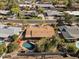 A full aerial shot reveals a home's position within a peaceful neighborhood, enhanced with a private pool and lush backyard at 318 E Concorda Dr, Tempe, AZ 85282