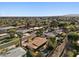 Expansive aerial showing the property's prime location amidst mature trees, residential streets, and stunning mountain views at 318 E Concorda Dr, Tempe, AZ 85282