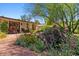 Beautifully landscaped backyard with vibrant flowers, outdoor seating, and a serene ambiance for relaxation and enjoyment at 318 E Concorda Dr, Tempe, AZ 85282