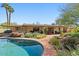 Spacious backyard with a refreshing pool, patio, and well-maintained landscaping, ideal for leisure and entertaining at 318 E Concorda Dr, Tempe, AZ 85282