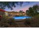 Inviting backyard pool area featuring lush landscaping, comfortable seating, and a well-maintained patio at 318 E Concorda Dr, Tempe, AZ 85282