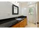 Bathroom with granite counters, tile backsplash and floors at 318 E Concorda Dr, Tempe, AZ 85282