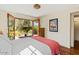 Bedroom with french doors, hardwood floors and a decorative ceiling light at 318 E Concorda Dr, Tempe, AZ 85282