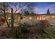 Single-story home with desert landscaping, cacti, and a red front door at 318 E Concorda Dr, Tempe, AZ 85282