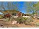 Single-story home with desert landscaping, cacti, and a red front door at 318 E Concorda Dr, Tempe, AZ 85282