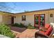 Cozy outdoor patio with stone flooring, comfortable seating, and lush greenery at 318 E Concorda Dr, Tempe, AZ 85282