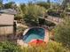 An aerial view of a backyard oasis with a sparkling pool and lush landscaping, perfect for relaxation and entertainment at 318 E Concorda Dr, Tempe, AZ 85282