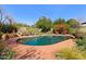 Inviting backyard pool surrounded by colorful flower gardens, creating a beautiful private oasis at 318 E Concorda Dr, Tempe, AZ 85282