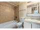 Tiled bathroom with bathtub, toilet, sink, and vanity at 3313 N 68Th St # 111, Scottsdale, AZ 85251