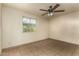 Bedroom featuring a ceiling fan and tile flooring with natural light at 3313 N 68Th St # 111, Scottsdale, AZ 85251