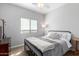 Neutral bedroom with a metal bed frame, soft carpet, and a bright window at 33731 N Slate Creek Dr, San Tan Valley, AZ 85143