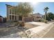 View of the home's two-car garage and neutral stucco at 33731 N Slate Creek Dr, San Tan Valley, AZ 85143