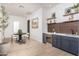 Chic bar area with a wine refrigerator, sleek cabinetry, and elegant decor, perfect for entertaining guests at 3628 E Clarendon Ave, Phoenix, AZ 85018