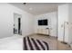 Spacious main bedroom featuring a walk-in closet, modern dresser, and ample natural light at 3628 E Clarendon Ave, Phoenix, AZ 85018