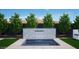 A modern outdoor space features a tiled waterfall feature, in-ground pool, manicured lawn and landscaping at 3628 E Clarendon Ave, Phoenix, AZ 85018
