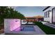Stunning outdoor space featuring a tiled waterfall feature, pool, fire pit, and modern patio seating at 3628 E Clarendon Ave, Phoenix, AZ 85018
