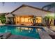 Enjoy backyard with pool views, mature palm trees, covered patio and large windows that illuminate the interior at 3887 E Andre Ave, Gilbert, AZ 85298