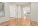 Open dining room with wooden floors and multiple doorways to other areas of the house at 3887 E Andre Ave, Gilbert, AZ 85298