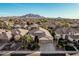 Beautiful single-Gathering home featuring a three-car garage and desert landscaping at 3887 E Andre Ave, Gilbert, AZ 85298