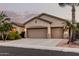 Charming single-story home featuring a spacious three-car garage, desert landscaping, and neutral color palette at 3887 E Andre Ave, Gilbert, AZ 85298