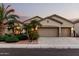 Charming single-story home featuring a spacious three-car garage, desert landscaping, and neutral color palette at 3887 E Andre Ave, Gilbert, AZ 85298