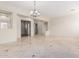 An airy living room with ample light, designer tile, and a view of multiple rooms at 3887 E Andre Ave, Gilbert, AZ 85298