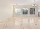 An airy living room with ample light, designer tile, and a view of the front yard at 3887 E Andre Ave, Gilbert, AZ 85298