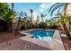 Inviting backyard pool with palm trees, ideal for relaxation and entertaining at 3887 E Andre Ave, Gilbert, AZ 85298