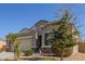 Charming single-Gathering home with a two-car garage, desert landscaping and tile roof at 3973 N 310Th Ln, Buckeye, AZ 85396