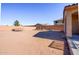 Large, undeveloped backyard space with a trampoline and shed, offering endless possibilities at 41124 W Rio Bravo Dr, Maricopa, AZ 85138