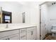 Bright bathroom with white cabinets and light colored flooring, a great place to start your day at 41124 W Rio Bravo Dr, Maricopa, AZ 85138