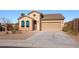 Charming single-story home featuring desert landscaping, a tile roof, and an attached two-car garage at 41124 W Rio Bravo Dr, Maricopa, AZ 85138