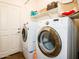 Well-lit laundry room with modern washer and dryer, providing convenience and functionality at 41124 W Rio Bravo Dr, Maricopa, AZ 85138