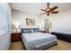 Serene main bedroom with ensuite bathroom and ceiling fan at 41124 W Rio Bravo Dr, Maricopa, AZ 85138