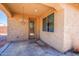 Covered patio with decorative chandelier, perfect for outdoor relaxing at 41124 W Rio Bravo Dr, Maricopa, AZ 85138