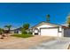 Single-story home featuring a desert landscaped yard and an attached two-car garage at 4154 W Grovers Ave, Glendale, AZ 85308