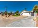 Single-story home featuring a desert landscaped yard and an attached two-car garage at 4154 W Grovers Ave, Glendale, AZ 85308