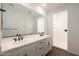 Bathroom featuring double sinks, modern fixtures, and a glass-enclosed walk-in shower at 4169 W Eli Dr, San Tan Valley, AZ 85144