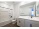 Bathroom featuring a shower/tub combo with modern black fixtures and a white vanity at 4169 W Eli Dr, San Tan Valley, AZ 85144