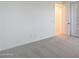 Carpeted bedroom featuring a closet with sliding doors and an entrance to another room at 4169 W Eli Dr, San Tan Valley, AZ 85144