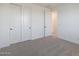 Bedroom boasts a large closet, new carpet, and plenty of natural light at 4169 W Eli Dr, San Tan Valley, AZ 85144