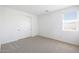 Bright bedroom features a window and a closet with sliding doors at 4169 W Eli Dr, San Tan Valley, AZ 85144