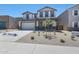 Two story home featuring a two-car garage, neutral color palette, and a low maintenance desert landscape at 4169 W Eli Dr, San Tan Valley, AZ 85144