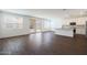 A bright, open living space features plank tile flooring, white walls, recessed lights, and slider doors to backyard at 4169 W Eli Dr, San Tan Valley, AZ 85144