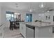 Open-concept kitchen with granite counters, stainless steel dishwasher, and an adjacent dining area at 42195 W Lavender Dr, Maricopa, AZ 85138