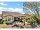 Beautiful backyard featuring a fire pit with cushioned seating and manicured landscaping at 42920 W Kingfisher Dr, Maricopa, AZ 85138