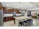 Gourmet kitchen with a large kitchen island, stainless steel appliances, and extensive cabinetry at 42920 W Kingfisher Dr, Maricopa, AZ 85138