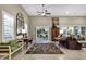 Spacious living room with plantation shutters, eclectic furnishings, and lots of natural light at 42920 W Kingfisher Dr, Maricopa, AZ 85138